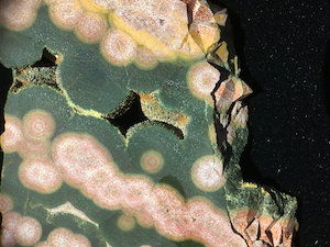 Figure 4: Interior view of two specimens of Ocean Jasper, Kabamby (shown here) and Marovato. These show the common quartz druzy growth on top of botryoidal chalcedony forms. Lieber's Fig. 4 is of a similar Kabamby specimen. Specimen widths: ~40mm (Kabamby, shown here).